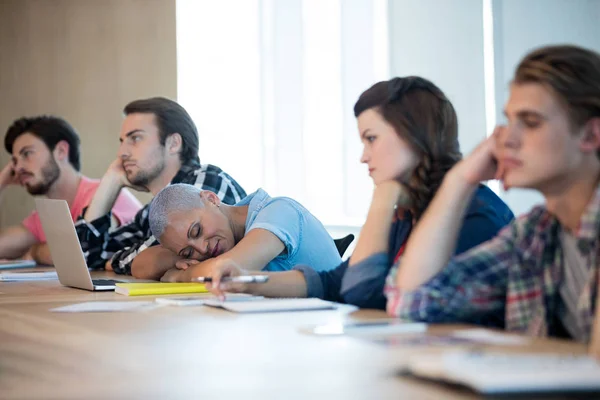 Bored creative business team attending a meeting — Stock Photo, Image