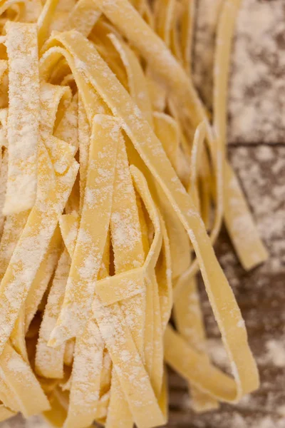Fettuccine pasta dusted with flour — Stock Photo, Image