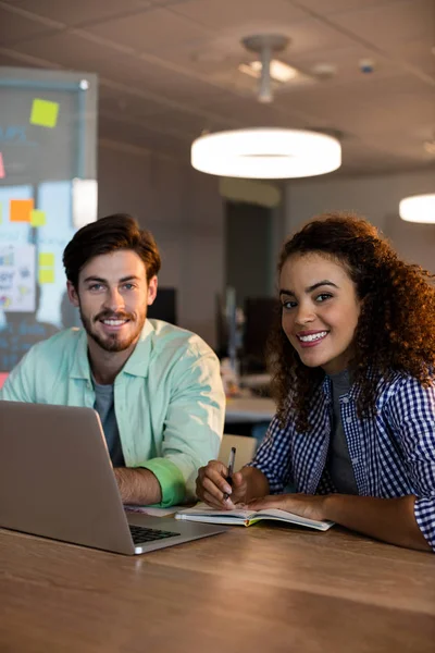 Creative business people working on desk at office — Stock Photo, Image