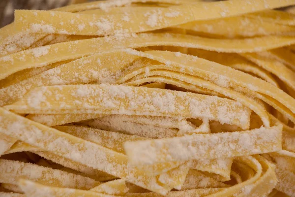 Fettuccine pasta dusted with flour — Stock Photo, Image