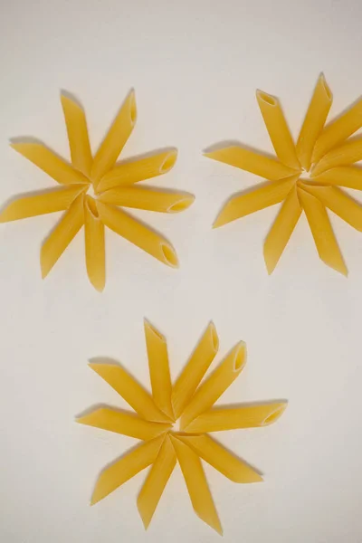 Flowers formed of pennette pasta — Stock Photo, Image