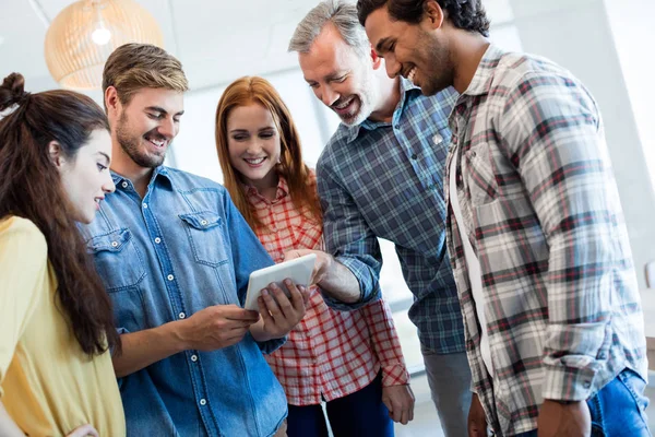 Creative business team using digital tablet — Stock Photo, Image