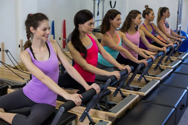 Group of women exercising on reformer — Stock Photo, Image