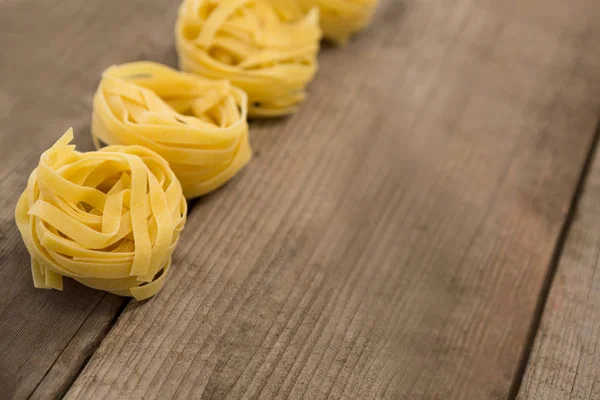 Fettuccine pasta arranged in a row — Stock Photo, Image