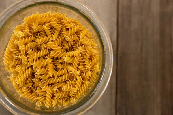Girandole pasta in a glass container — 스톡 사진