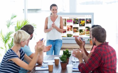 Young business team clapping hands clipart