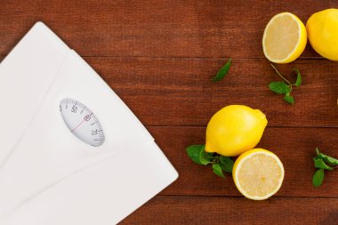 weighting scale with lemons clipart