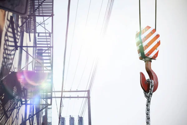 Composite image of studio shoot of a crane lifting hook — Stock Photo, Image