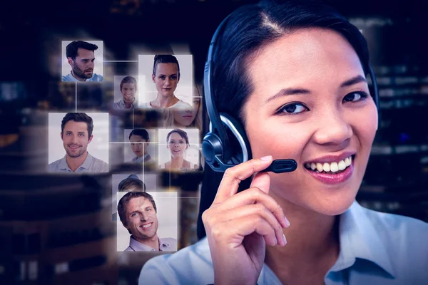 Smiling businesswoman using headset — Stock Photo, Image