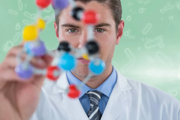 Composite image of young scientist experimenting molecule structure 3d — Stock Photo, Image