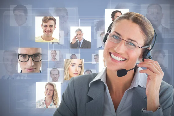 Composite image of portrait of a call center executive wearing headset — Stock Photo, Image