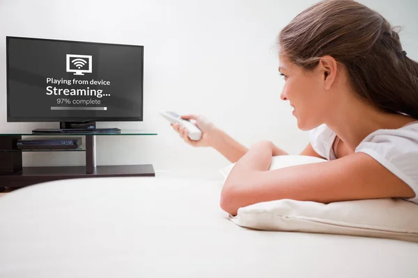 Woman watching television — Stock Photo, Image