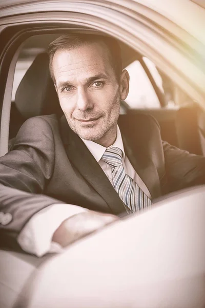 Businessman sitting in car — Stock Photo, Image