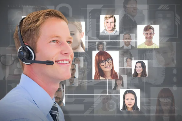 Composietbeeld van knappe agent met headset — Stockfoto