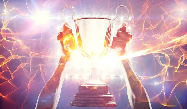 Composite image of composite image of cropped hand of athlete holding 3dtrophy — Stock Photo, Image