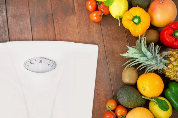 Weighting scale with tropical fruits — Stock Photo, Image