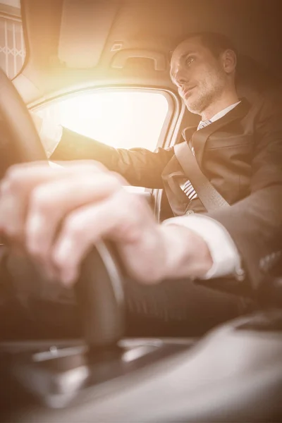 Businessman in drivers seat in car — Stock Photo, Image