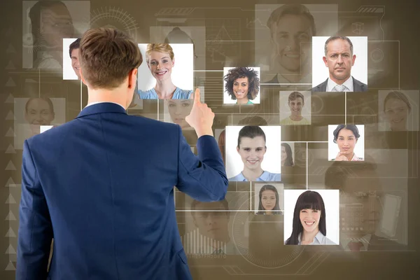 Composite image of businessman pointing something with his finger — Stock Photo, Image