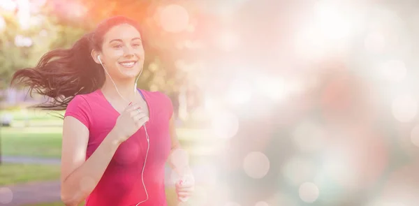 Woman jogging in a park — Stock Photo, Image