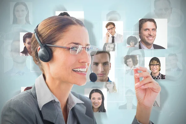Composite image of businesswoman wearing headset — Stock Photo, Image
