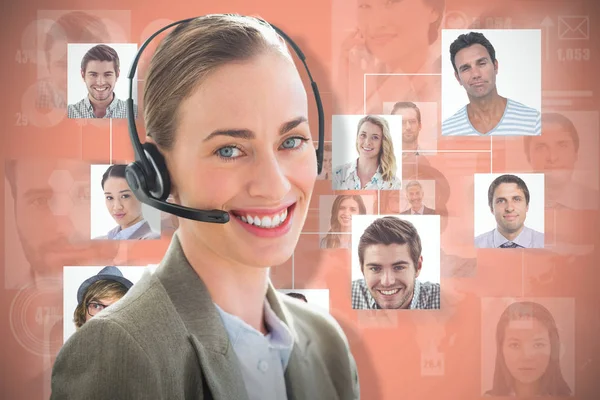 Image composite de femme d'affaires souriante avec casque à l'aide d'ordinateurs — Photo