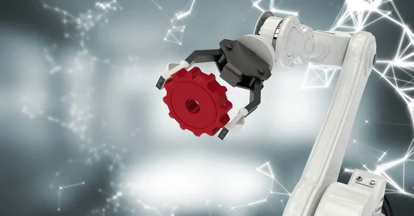Pince robot blanche avec rouage rouge et interface blanche contre chambre grise floue — Photo