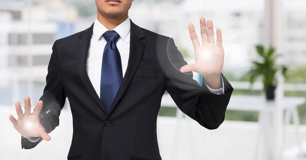 Business man mid section with flares on hands in blurry office — Stock Photo, Image