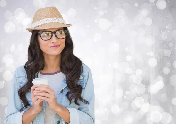 Woman in fedora with white coffee cup against white bokeh — Stock Photo, Image
