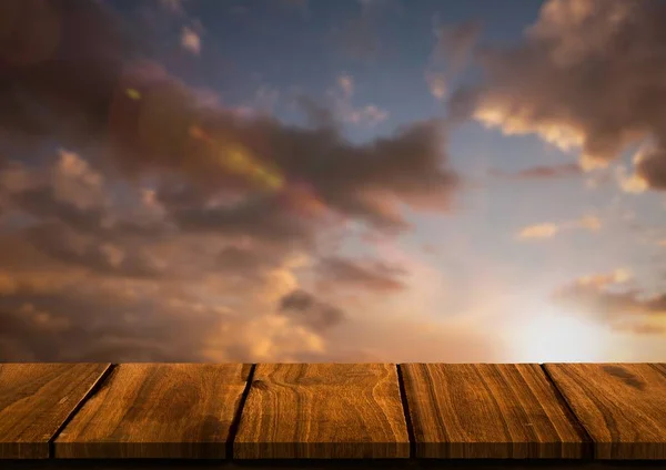 Wood table against sunset — Stock Photo, Image