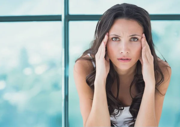 Stressed worried woman against window — Stock Photo, Image