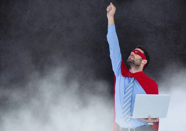 Superherói de negócios contra parede de pedra com nuvens — Fotografia de Stock