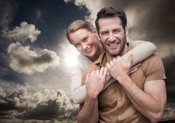 Woman with arms around man — Stock Photo, Image