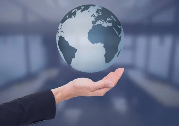 Open palm business hand holding world earth globe in front of blue room — Stock Photo, Image