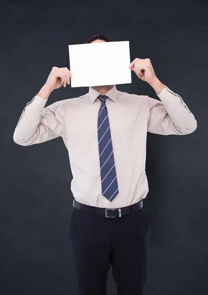 Hombre de negocios con tarjeta en la cara — Foto de Stock