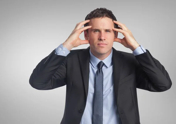 Stressad affärsman med grå bakgrund — Stockfoto