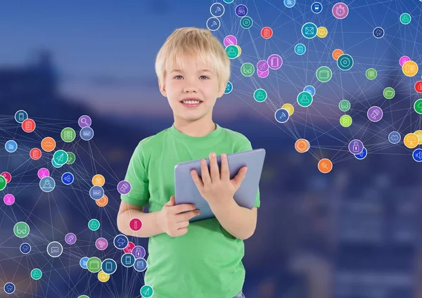 Boy with tablet against Night city with connectors — Stock Photo, Image