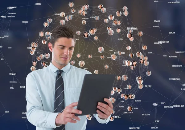 Businessman with tablet against Night city with connectors — Stock Photo, Image