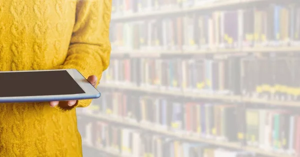 Woman on tablet in Library — Stock Photo, Image