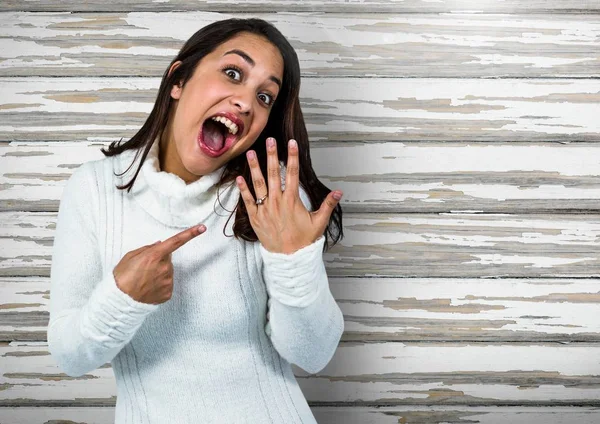 Engaged Woman with ring excited against wood — Stock Photo, Image