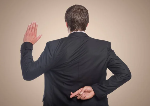 Back of business man with hand up and fingers crossed — Stock Photo, Image