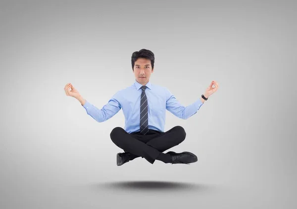 Uomo d'affari Meditando galleggiante — Foto Stock