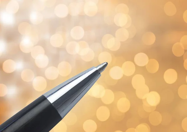 Pen tip against sparkles glow lights — Stock Photo, Image