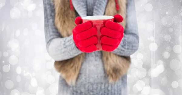 Woman mid section with red coffee cup against white bokeh — Stock Photo, Image