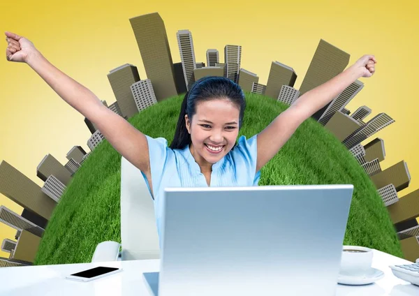 Woman at Desk with hands in air against globe with buildings and yellow background — Stock Photo, Image