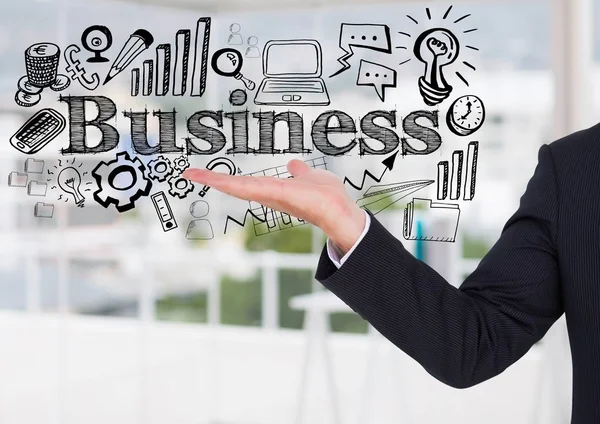 Biznes człowiek rękę i biznes czarny doodles przeciwko office rozmazane — Zdjęcie stockowe
