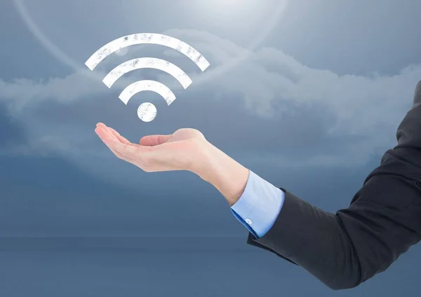 Open palm business hand in sky with wi-fi icon — Stock Photo, Image