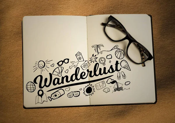 Open boek met glazen en zwarte design doodles op zand — Stockfoto