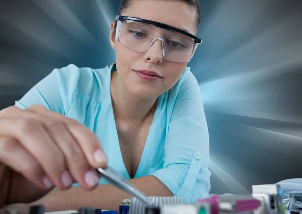 Woman with electronics against motion blur — Stock Photo, Image