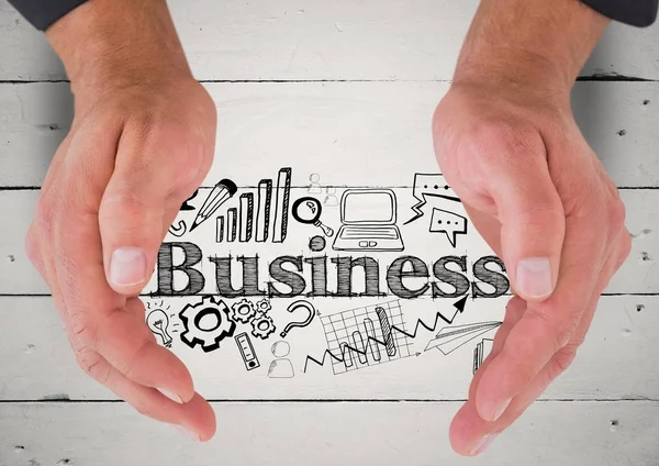 Händerna runt business doodles mot vitt trä — Stockfoto