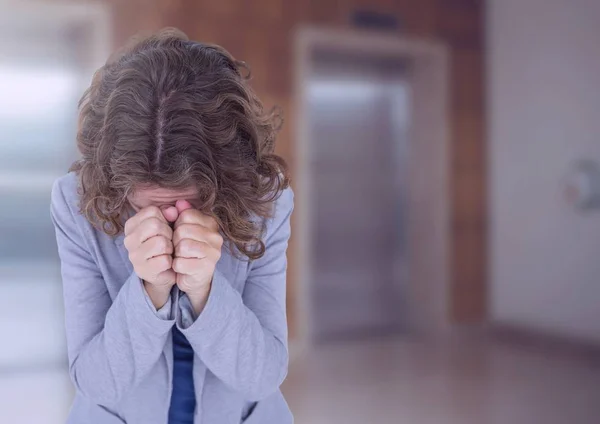 Woman crying in front of elevators — Stock Photo, Image